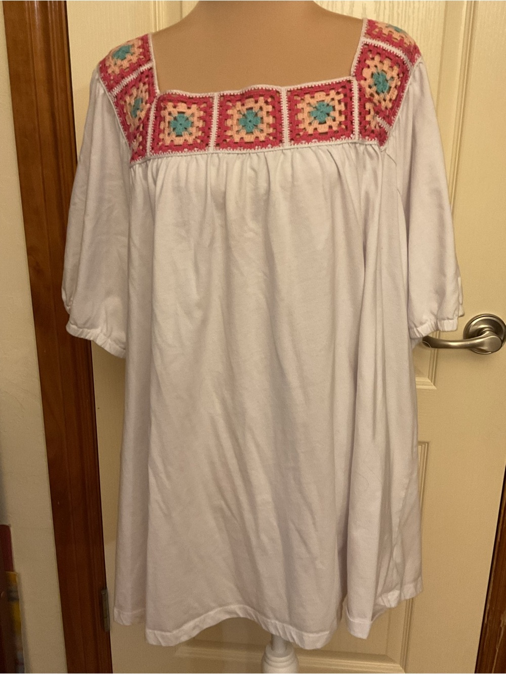 Woman Within White Top with Pink, Peach & Teal Crochet Detail